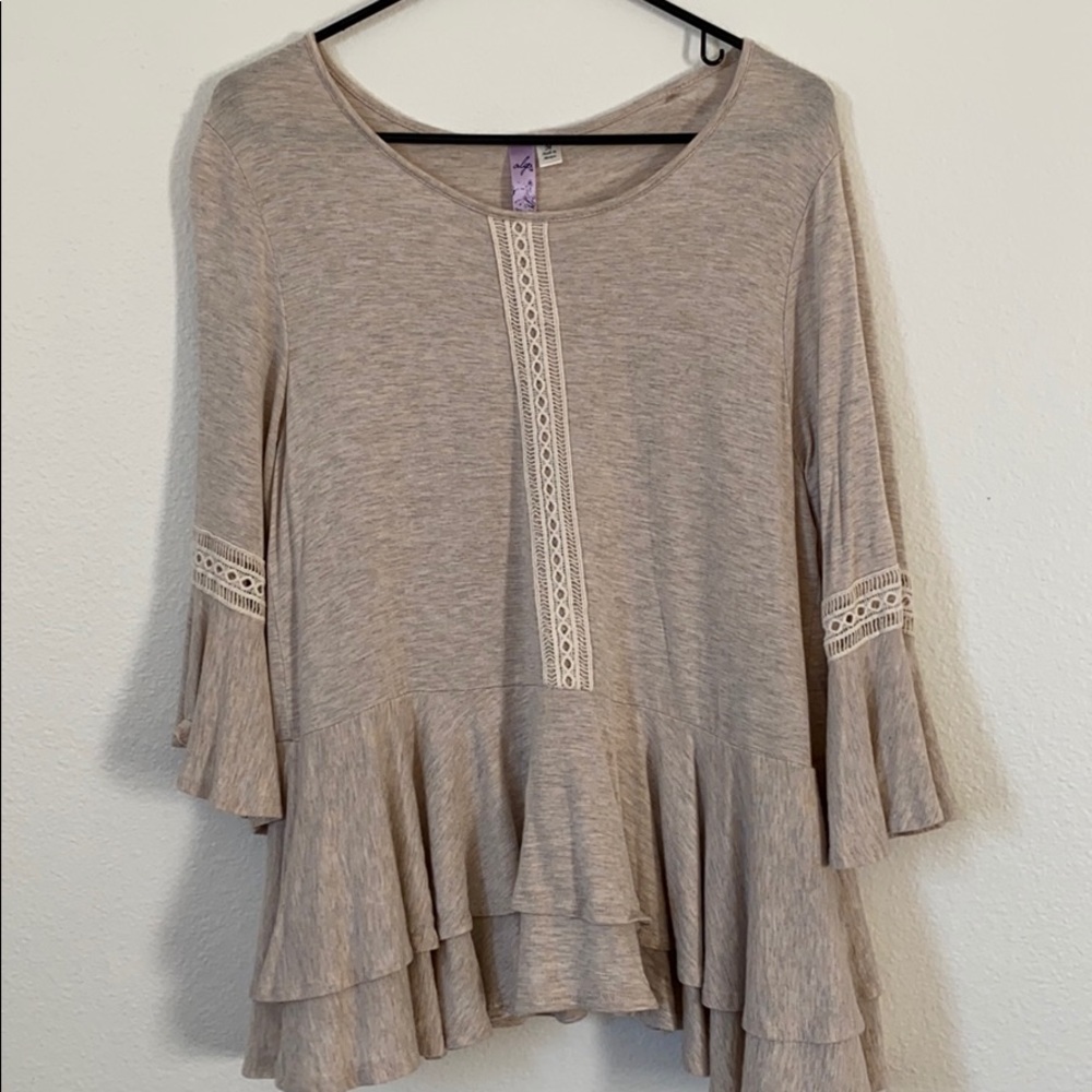 cream/tan colored blouse with lace detail